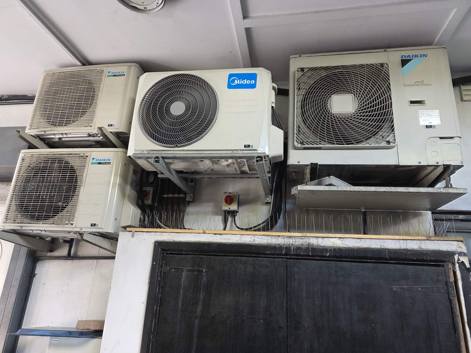 Daikin and Midea commercial air conditioning condensers serviced in Stockwell