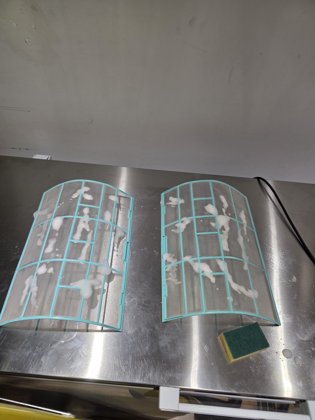 Air conditioning filters washed during a commercial service in Stockwell